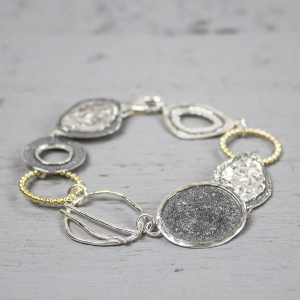 JEH collection armband ogen en cirkels en vergulde ringen - 212599 JEH collection armband ogen en cirkels en vergulde ringen - 212599