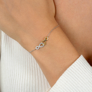 ZINZI zilveren armband bicolor vebonden infinity met 1 zirconia - 2010852 ZINZI zilveren armband bicolor vebonden infinity met 1 zirconia - 2010852